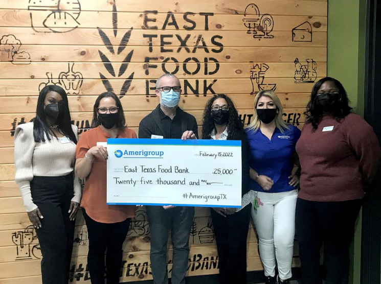 ETS food bank check presentation